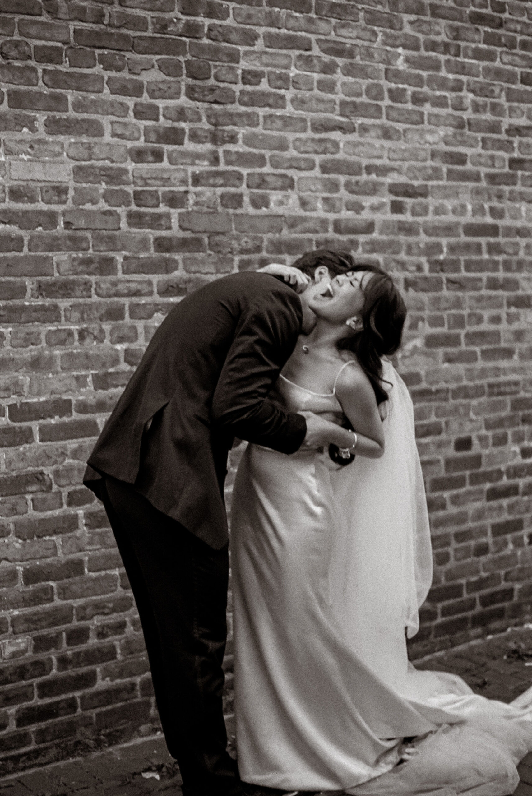 wedding portrait in black and white bride laughing shot on film by parkers pictures