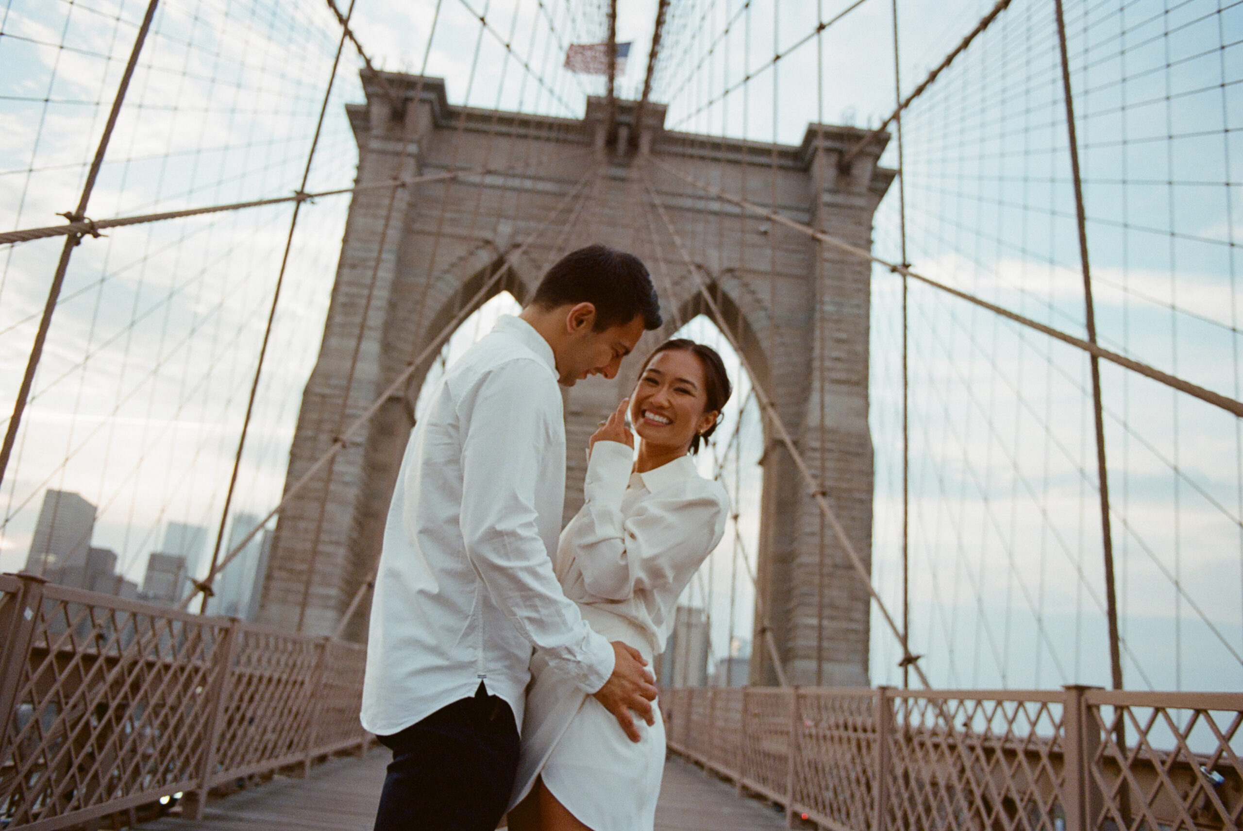 engagement photo on the brooklyn bridge shot on film by parkers pictures